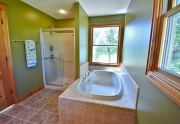 Soaking tub with views of lake