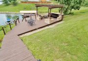 Wood and stone pergola with seating