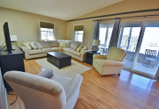 Living room opens to sunroom