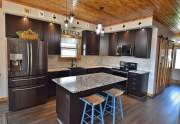 Black stainless appliances and farmhouse sink