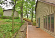 Deck leading to walkway and garage